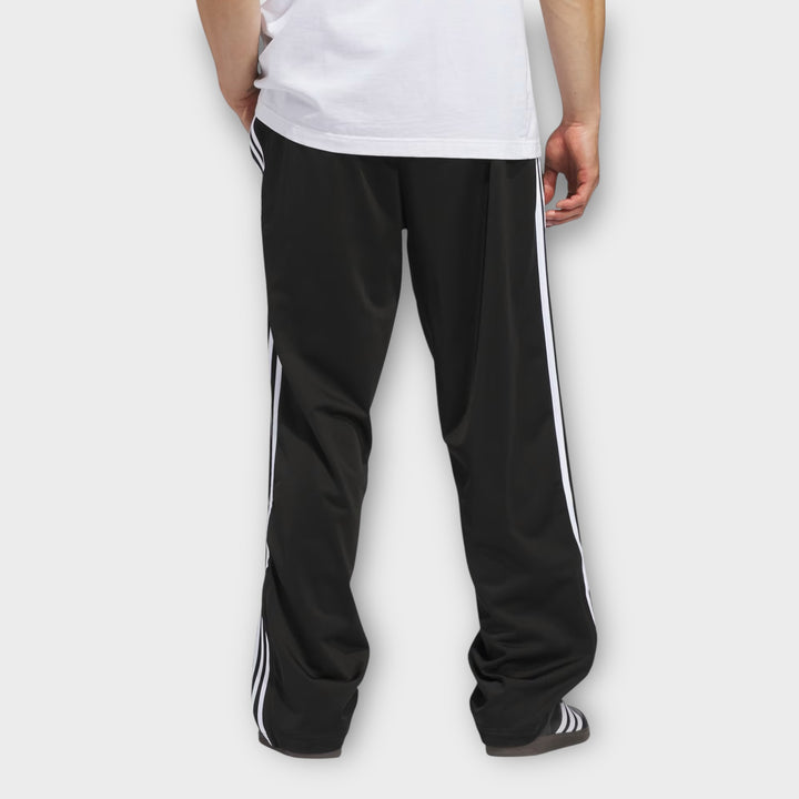 Adidas Firebird trackpants i sort set bagfra