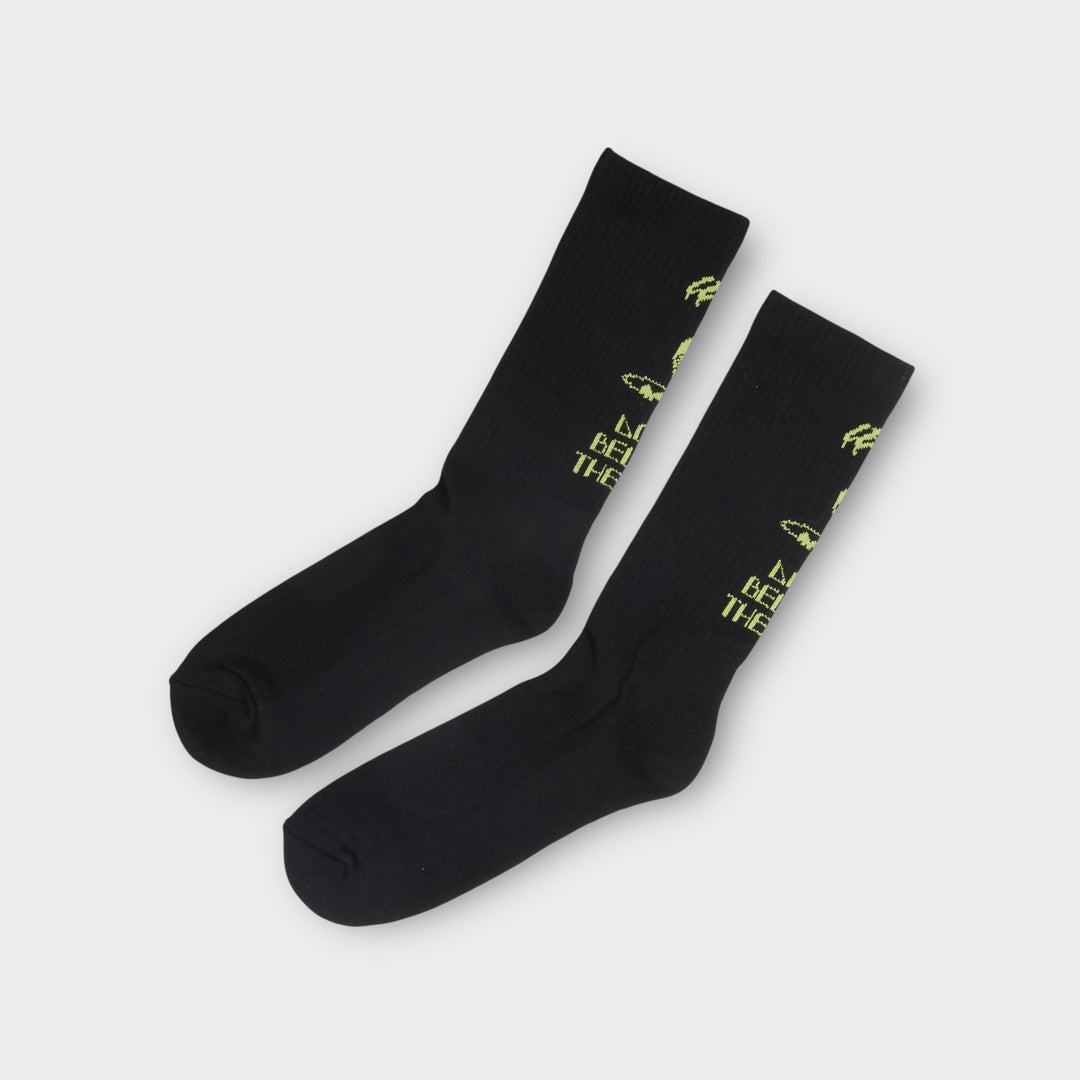 Sorte Le Fix DBTH tennis sokker med neon-gul alien- og tekstgrafik.