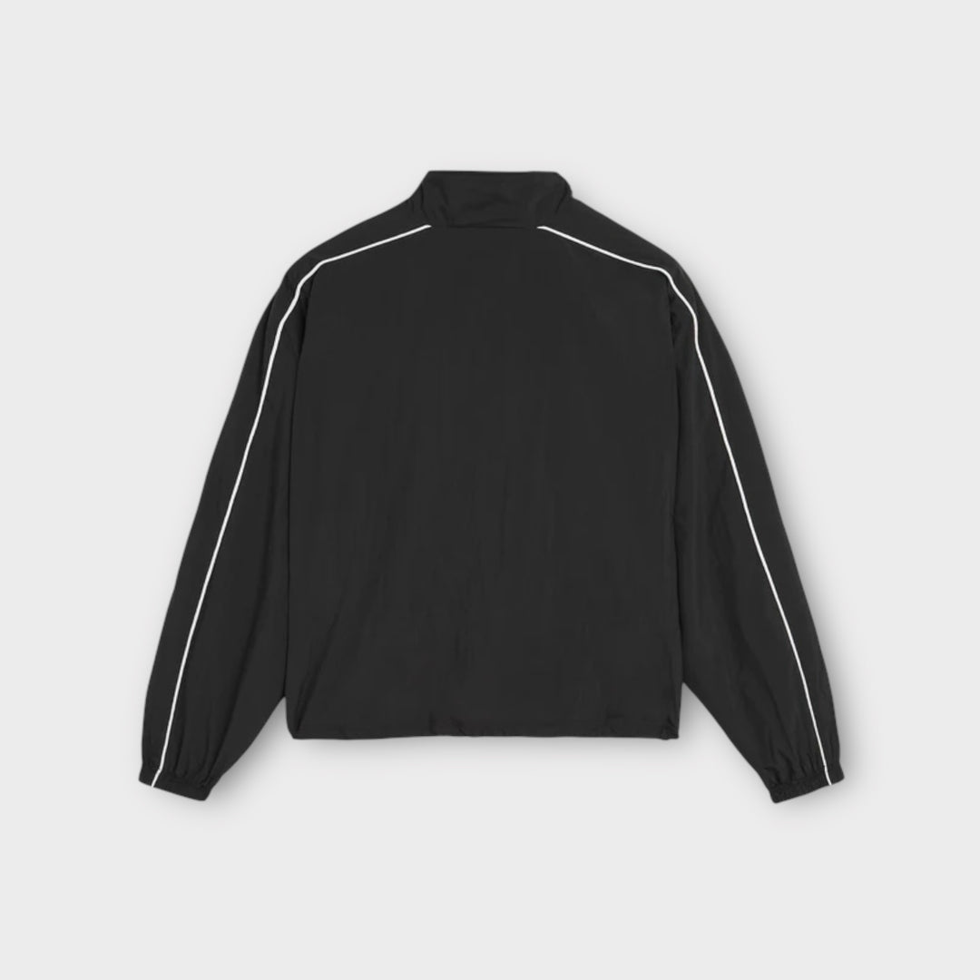 Lynlåslukning detalje på Patta Athletic Nylon Track Jakke i sort