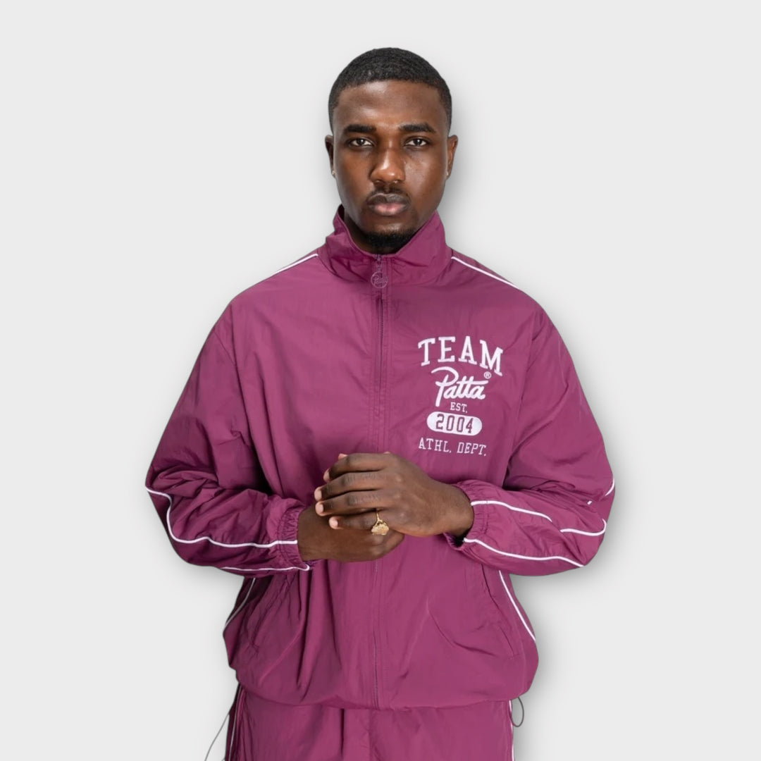 Lynlåslukning detalje på Patta Athletic Nylon Track Jakke
