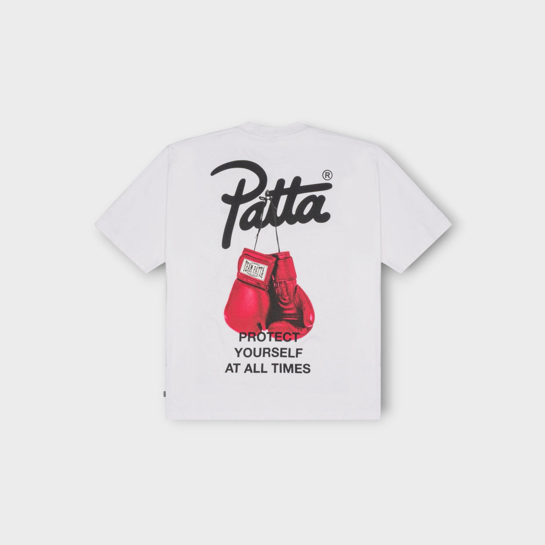 Patta Protect Yourself T-Shirt i hvid med grafisk print på front