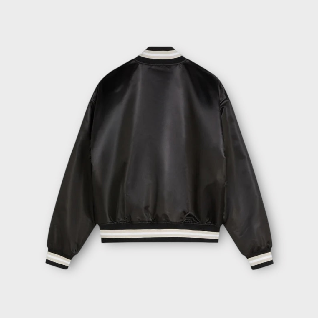 Detaljebillede af trykknapper på Patta satin bomber
