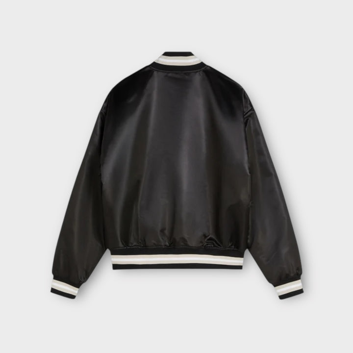 Detaljebillede af trykknapper på Patta satin bomber