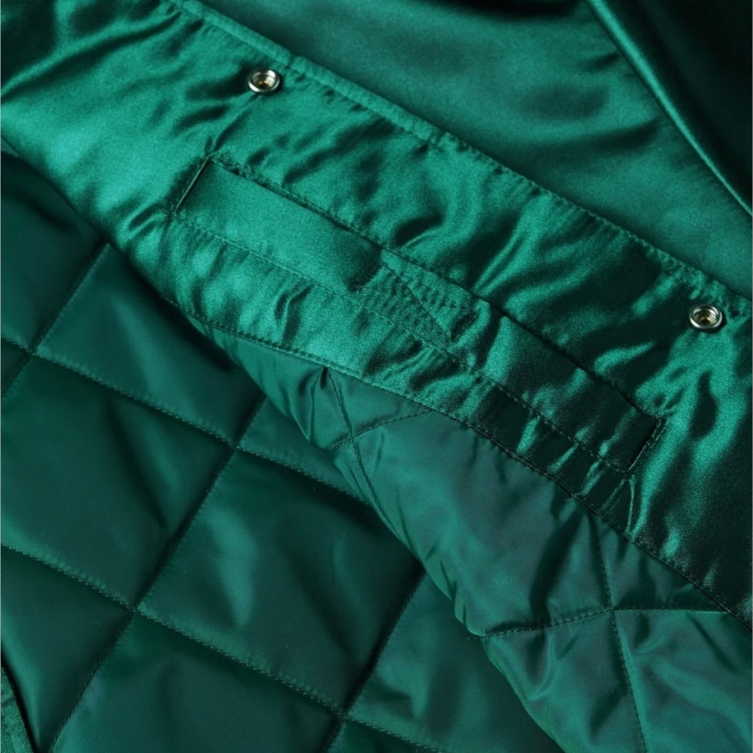 Quiltet foring og isolering i Patta grøn satinjakke