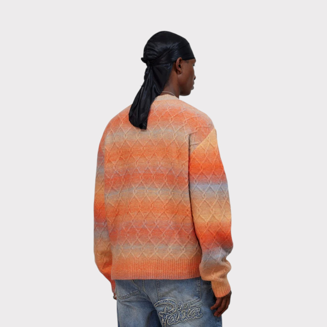 Tæt billede af Patta Space Dye Cable Knitted Sweater i Multi på model