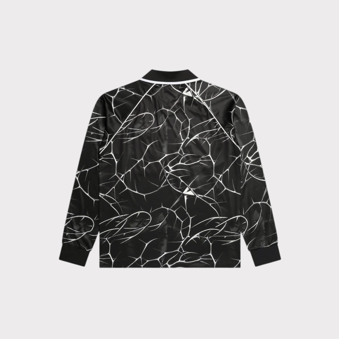 Patta Thorns Longsleeve Football Jersey vist forfra på model med Patta-logo og brystbadge