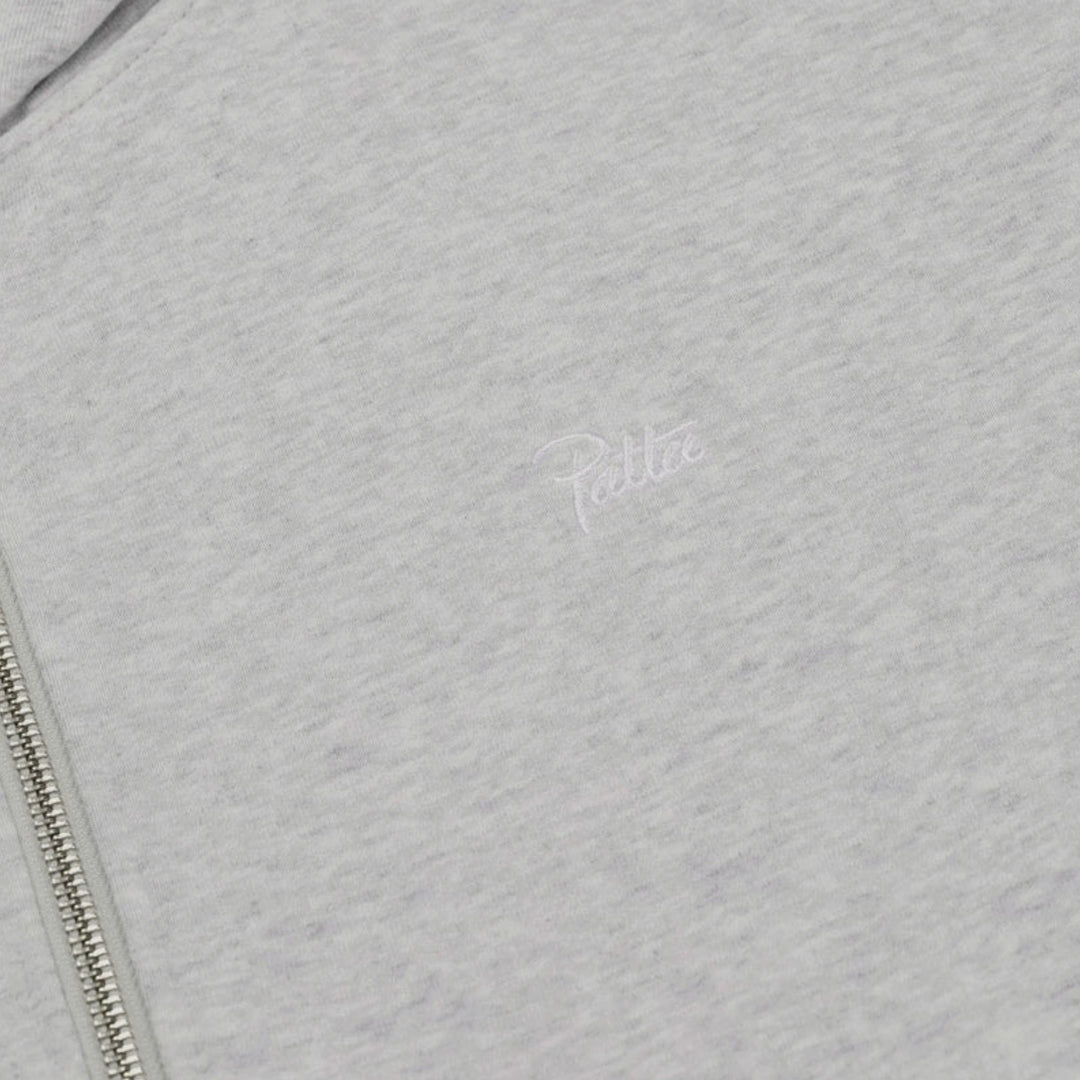 Close-up af waffle-strukturen på Patta Reversible Zip Up Hooded Sweater i Grey