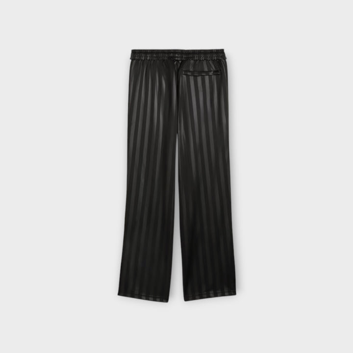 Puma T7 Track Pants set fra siden i sort.