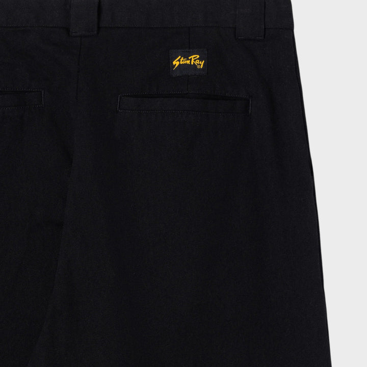 Nærbillede af indstukken baglomme og vævet Stan Ray-logomærke på A Pant i Black Canvas