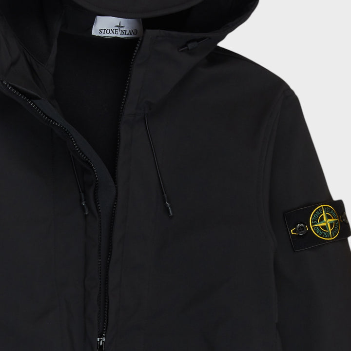 Close-up af hætte lynlås og Compass Badge på Stone Island jakke i Sort