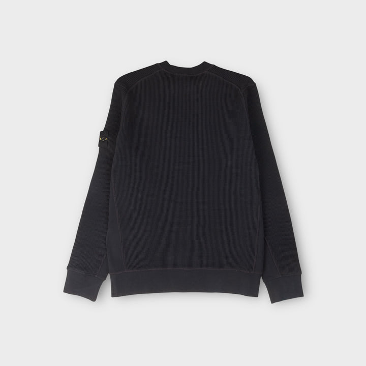 Detalje af Stone Island navy waffle fleece sweatshirt i organic cotton.