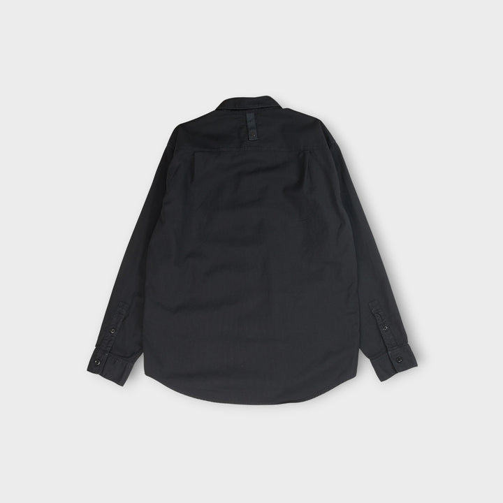 Stone Island oxford skjorte i navy i økologisk bomuld med broderet logo
Navy Stone Island skjorte i oxford bomuld med klassisk design