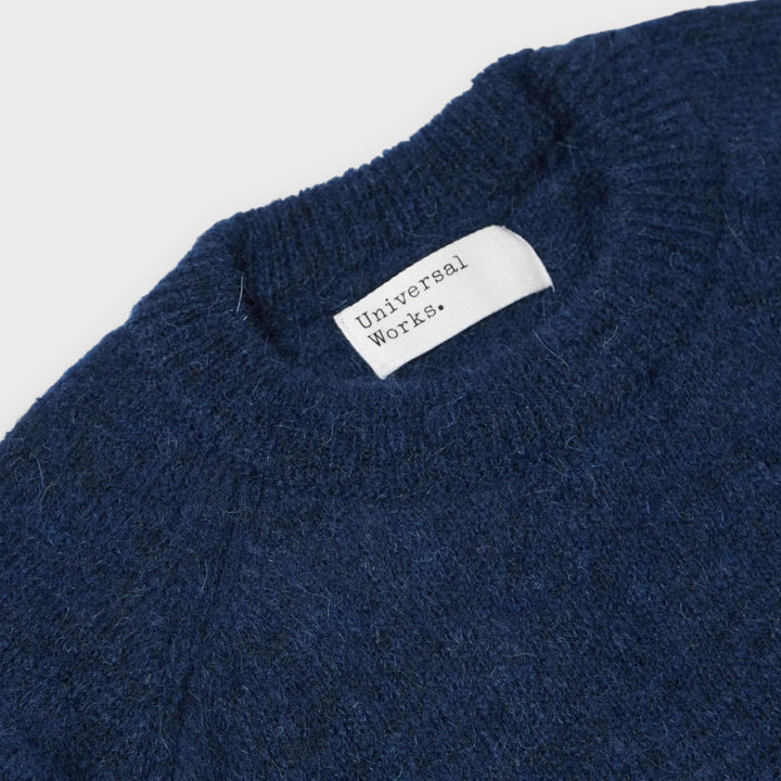 Navy alpaka-strik fra Universal Works til herre